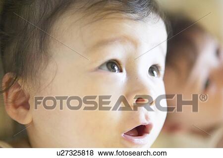 Close up of baby girl View Large Photo Image Stock Photo - Close up of baby girl. Fotosearch