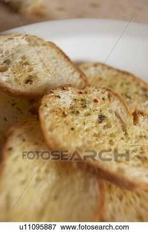 Stock Photo - Close up of garlic bread. Fotosearch