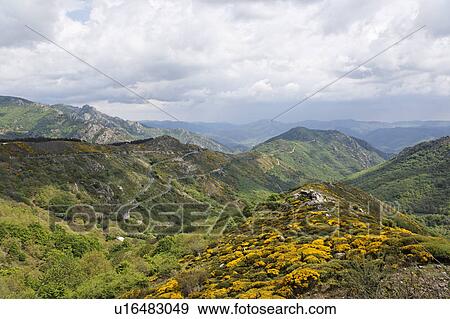 Stock Photo - Clouds in the Sky Over the Mountains, Herault, France. Fotosearch