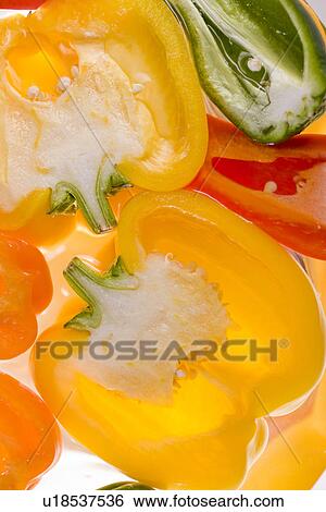 Colorful bell peppers cut in half, close up View Large Photo Image Stock Photograph - Colorful bell peppers cut in half, close up. Fotosearch