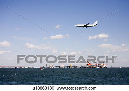 Commercial plane flying View Large Photo Image Stock Image - Commercial plane flying. Fotosearch