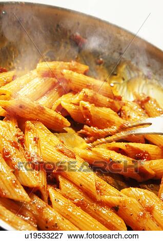 Stock Photo - Cooking penne pasta. Fotosearch