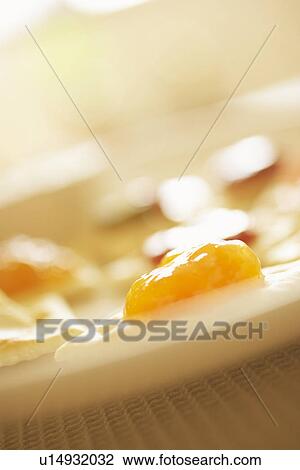 Crackers with jam, close up, differential focus View Large Photo Image Stock Image - Crackers with jam, close up, differential focus. Fotosearch