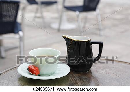 Stock Image - Cup of Cafe Au Laite on Table, Charente Maritime, France. Fotosearch