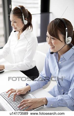 Stock Photo - Customer service representatives with headset. Fotosearch