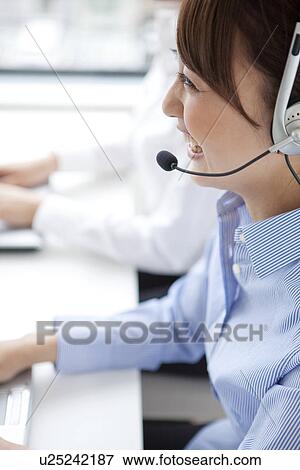 Stock Photo - Customer service representatives with headset. Fotosearch