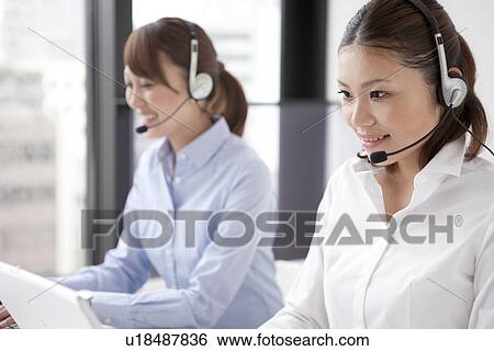 Stock Photograph - Customer Service Representatives with headset. Fotosearch