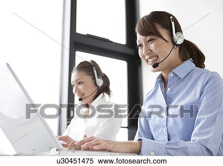 Stock Photography - Customer Service Representatives with headset. Fotosearch