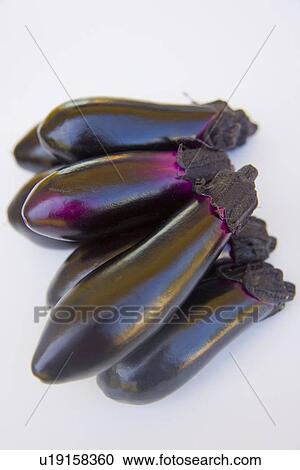 Stock Image - Eggplants, close up, white background. Fotosearch