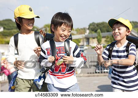 Elementary school students walking to school View Large Photo Image Stock Photo - Elementary school students walking to school. Fotosearch
