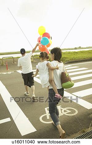 Family of three crossing street View Large Photo Image Stock Image - Family of three crossing street. Fotosearch