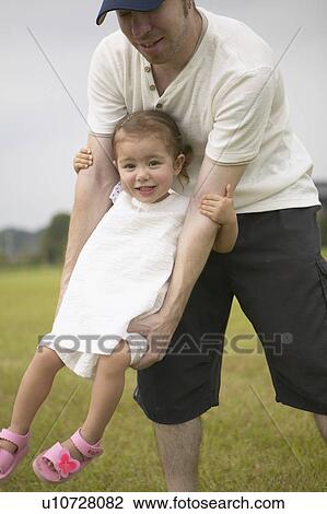Father carrying daughter View Large Photo Image Stock Image - Father carrying daughter. Fotosearch