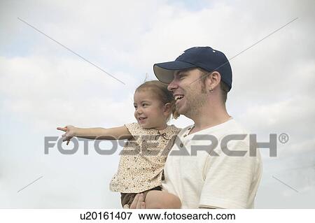 Father carrying daughter View Large Photo Image Stock Photo - Father carrying daughter. Fotosearch