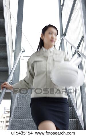 Picture - Female architect with a hardhat. Fotosearch