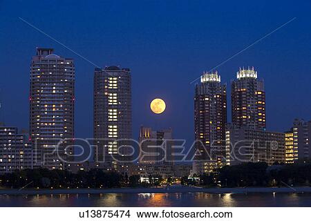 Picture - Full moon over Tokyo. Fotosearch
