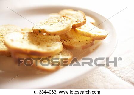 Garlic bread on plate View Large Photo Image Stock Image - Garlic bread on plate. Fotosearch