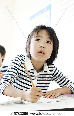 Girl at cram school smiling View Large Photo Image Stock Photograph - Girl at cram school smiling. Fotosearch
