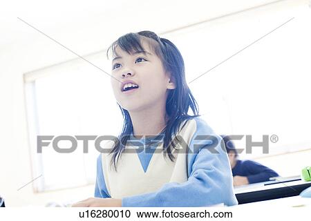 Stock Image - Girl at cram school. Fotosearch