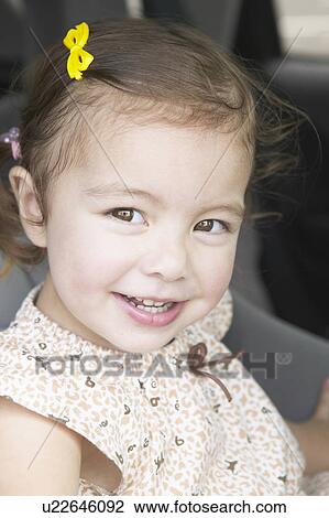 Stock Image - Girl in car. Fotosearch