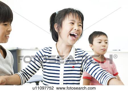 Girl laughing at cram school View Large Photo Image Stock Image - Girl laughing at cram school. Fotosearch
