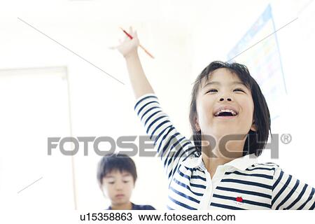 Girl raising her hand at cram school View Large Photo Image Stock Image - Girl raising her hand at cram school. Fotosearch