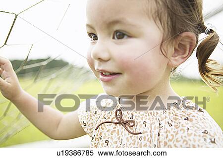 Girl under net View Large Photo Image Stock Photography - Girl under net. Fotosearch