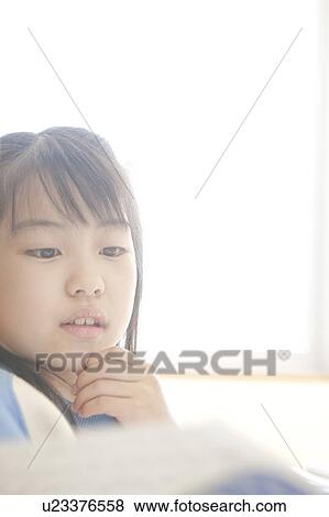 Stock Photo - Girl with hand on chin. Fotosearch