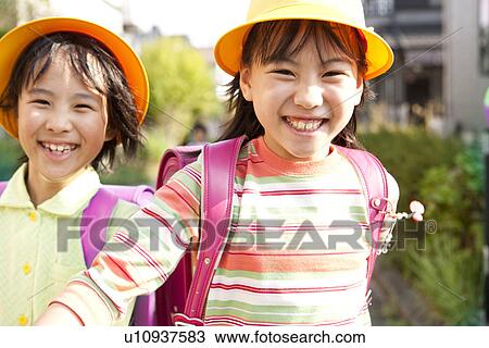 Stock Image - Girls laughing. Fotosearch