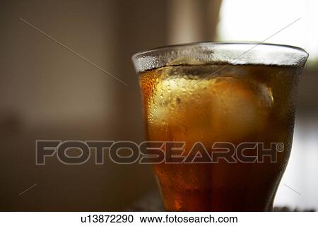 Glass of iced tea on table, close up, differential focus View Large Photo Image Stock Image - Glass of iced tea on table, close up, differential focus. Fotosearch