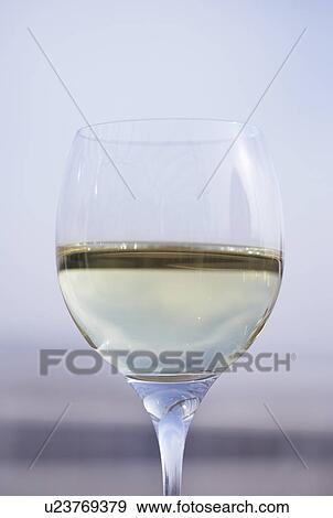 Glass of white wine, close up View Large Photo Image Stock Photo - Glass of white wine, close up. Fotosearch