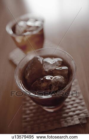 Glasses of iced tea on table, close up View Large Photo Image Stock Photography - Glasses of iced tea on table, close up. Fotosearch