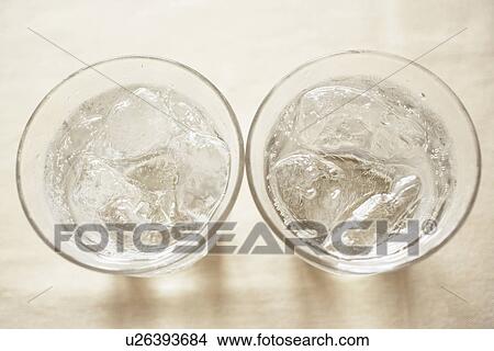 Picture - Glasses of soda on table, close up. Fotosearch