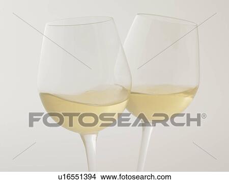 Glasses of white wine, close up, white background View Large Photo Image Picture - Glasses of white wine, close up, white background. Fotosearch
