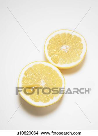 Grapefruit sliced in half, white background View Large Photo Image Picture - Grapefruit sliced in half, white background. Fotosearch