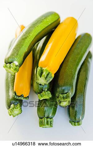 Green and yellow zucchini, close up, white background View Large Photo Image Stock Photo - Green and yellow zucchini, close up, white background. Fotosearch