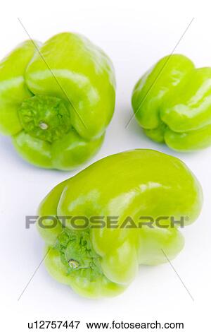 Stock Photo - Green bell peppers, close up, white background. Fotosearch