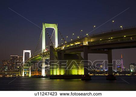 Illuminated Rainbow Bridge at night View Large Photo Image Stock Image - Illuminated Rainbow Bridge at night. Fotosearch