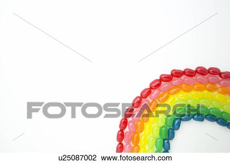 Stock Image - Jellybeans shaped as rainbow. Fotosearch