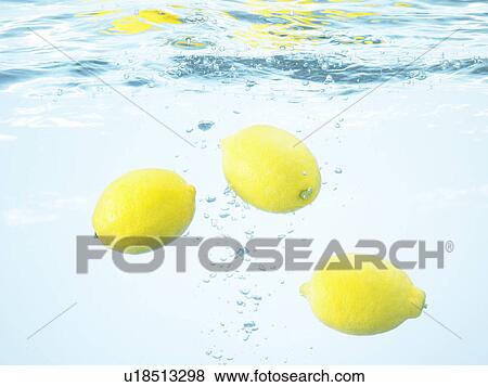 Stock Photo - Lemons underwater. Fotosearch