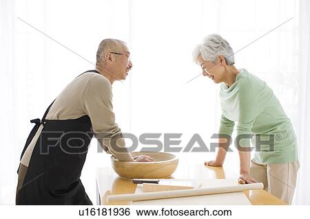 Mature couple making soba noodles, making dough View Large Photo Image Stock Photograph - Mature couple making soba noodles, making dough. Fotosearch