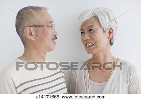 Mature couple smiling, white background View Large Photo Image Stock Photograph - Mature couple smiling, white background. Fotosearch