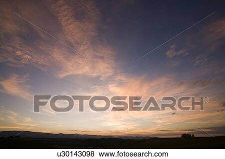 Mountain range and tree at dawn View Large Photo Image Stock Photo - Mountain range and tree at dawn. Fotosearch