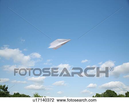 Stock Image - Paper airplane flying. Fotosearch
