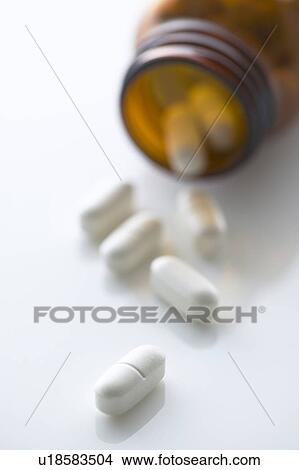 Pills and glass bottle View Large Photo Image Picture - Pills and glass bottle. Fotosearch