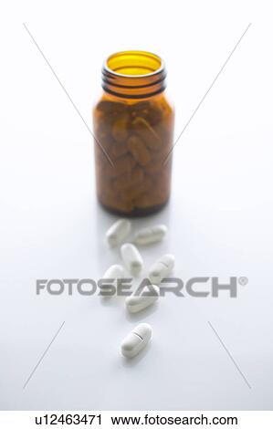 Pills and glass bottle View Large Photo Image Stock Image - Pills and glass bottle. Fotosearch