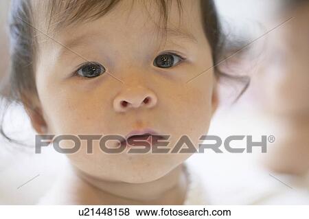 Stock Photo - Portrait of baby girl. Fotosearch