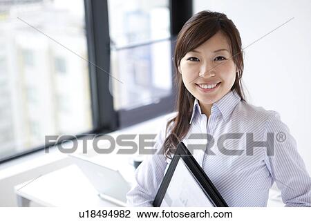 Stock Image - Portrait of businesswoman . Fotosearch