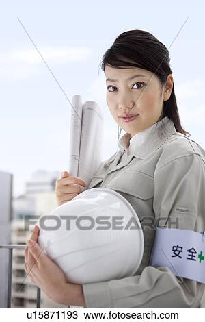 Portrait of female architect with hardhat and blueprint View Large Photo Image Stock Image - Portrait of female architect with hardhat and blueprint. Fotosearch