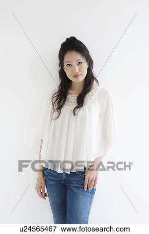 Stock Photo - Portrait of woman standing . Fotosearch