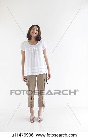 Stock Photograph - Portrait of woman standing . Fotosearch